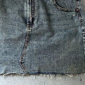 Denim mini skirt. Size 16. Frayed bottom.